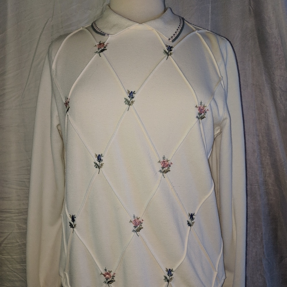 Rose embroidered collared crew neck sweater.